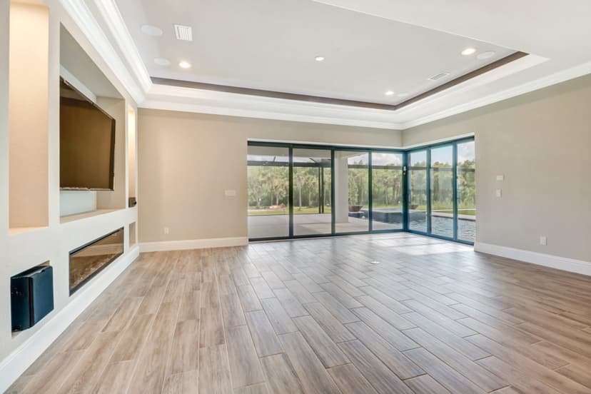 Custom home living area with tray ceiling