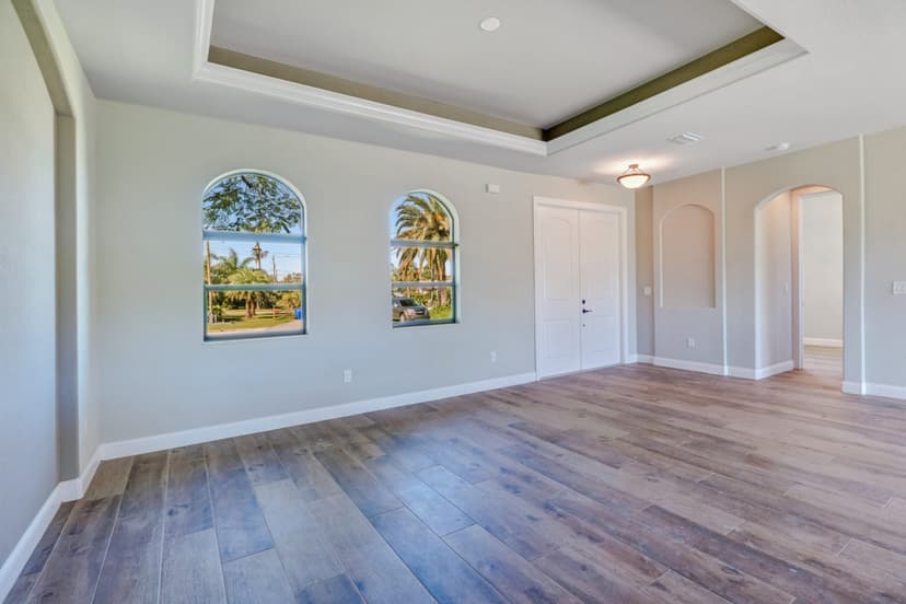 Custom home living area with tray ceiling