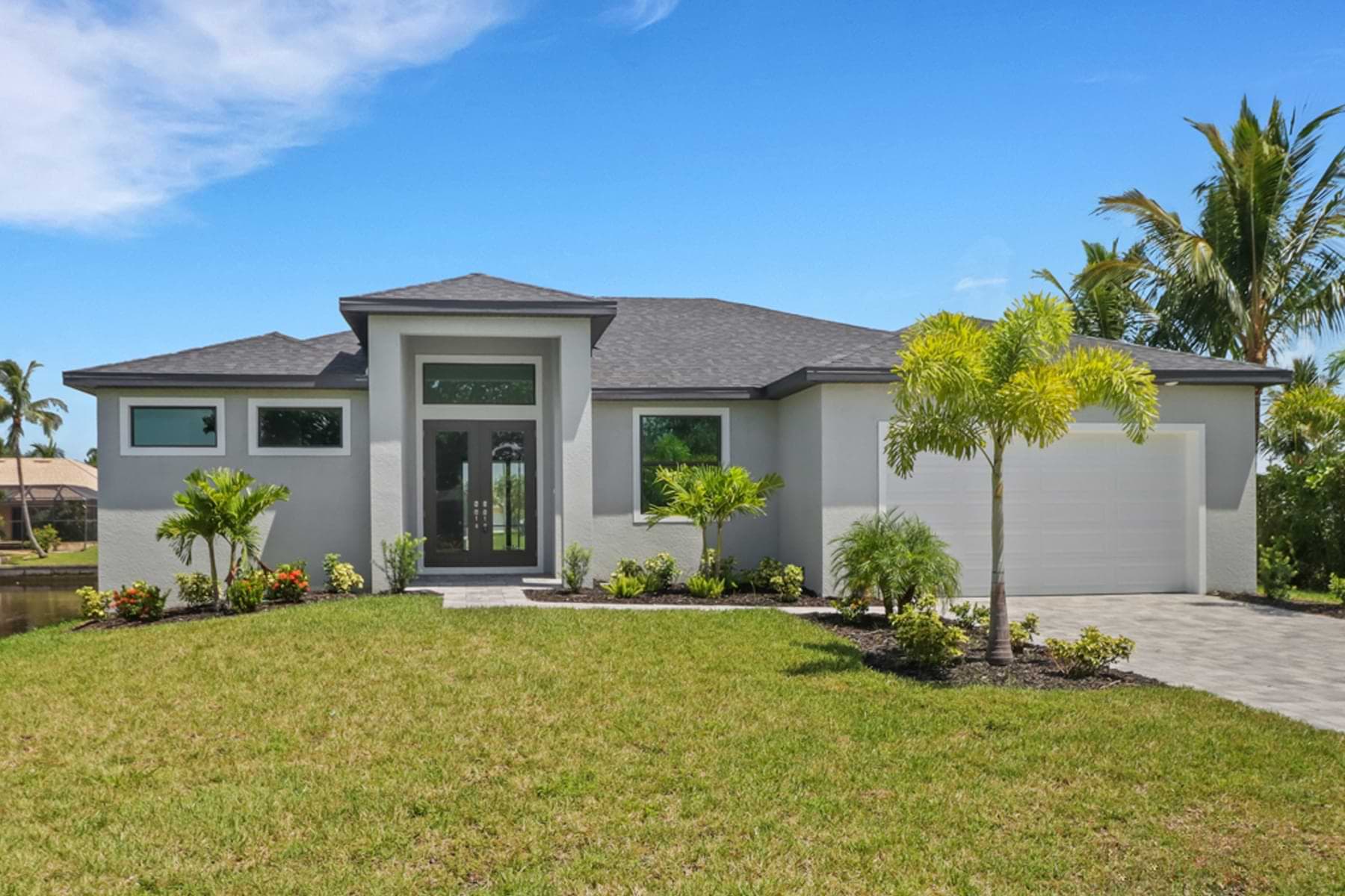 Front exterior view of the Signus model home with modern landscaping.